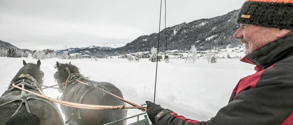 Mit dem Pferdeschlitten durch die malerische Landschaft am Weissensee